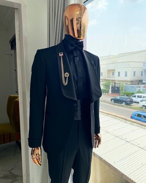 A charcoal black dinner shawl lapel tuxedo suit