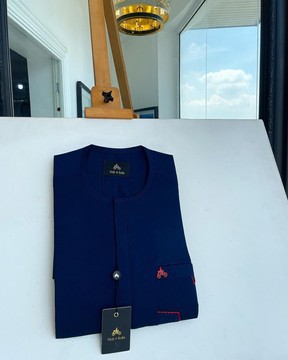 A navy blue, front flap &amp; red lane pocket detailing senator kaftan native.
