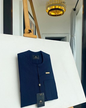 A pencil stripe blue,  African traditional senator kaftan native.