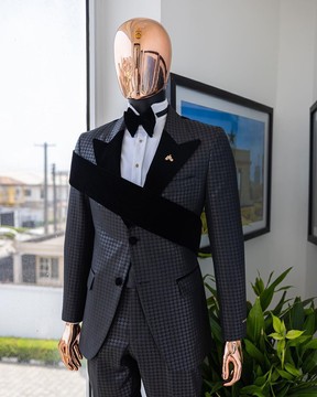 An “octopus” black inverted square patterned jacquard tuxedo with right strap black velvet suit