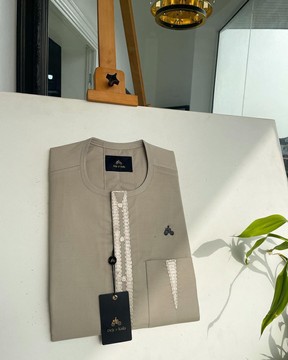A tortilla brown, connected triangle front flap &amp; pocket embroidery detailing kaftan
