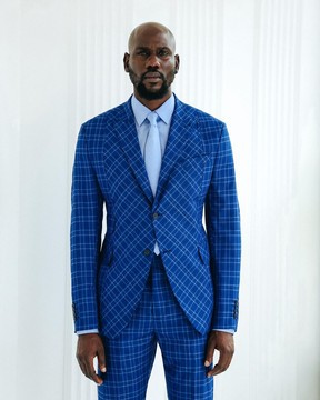 A windowpane relayed and inverted check peak lapel suit