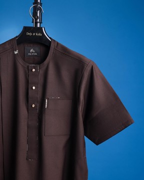 An umber brown, front flap, short sleeve and gold Swarovski button African kaftan native.
