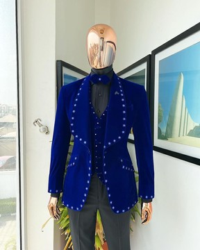 An Admiral Blue velvet shawl lapel tuxedo suit.