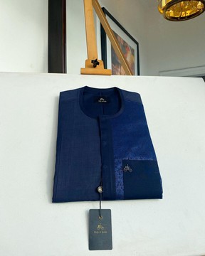 A midnight blue kaftan with a paisley flowery left section