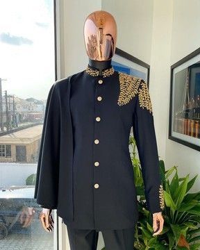 A charcoal black, hand “Ide” gold metal wire embroidery, right hand sache safari suit