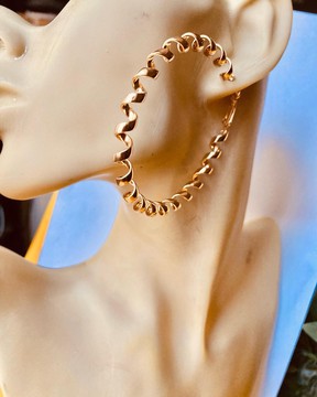 Pairs of golden hoop earrings