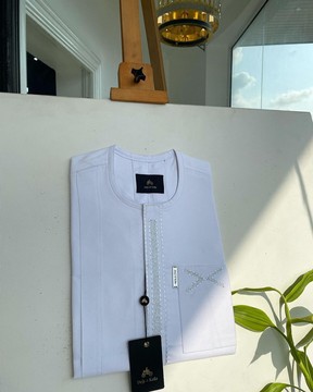 A white, dotted &amp; covered square embroidery detailing african traditional senator kaftan native.