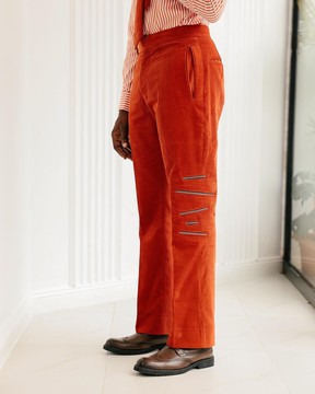 vermilion orange corduroy, zip-line detailing, boot-cut pant trousers