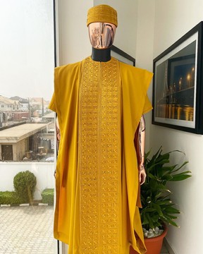 A gold yellow, connected square embroidery design with Swarovski stone agbada