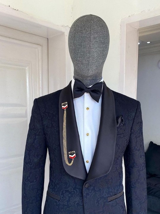 A charcoal black floral shawl lapel tuxedo suit