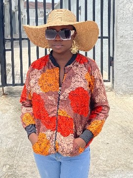 Veste bombardier unisexe africaine Ankara Wax (pêche/orange/marron)