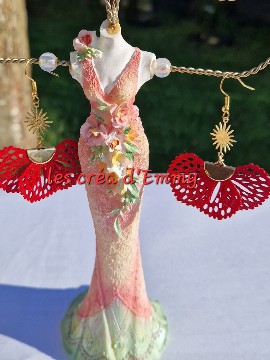 Golden earrings and fabrics